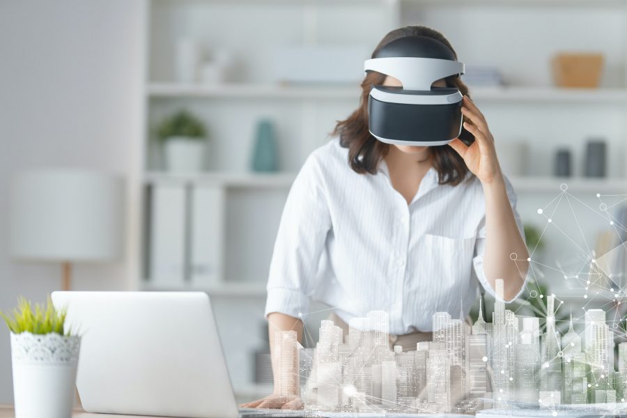 Woman with VR virtual reality goggles